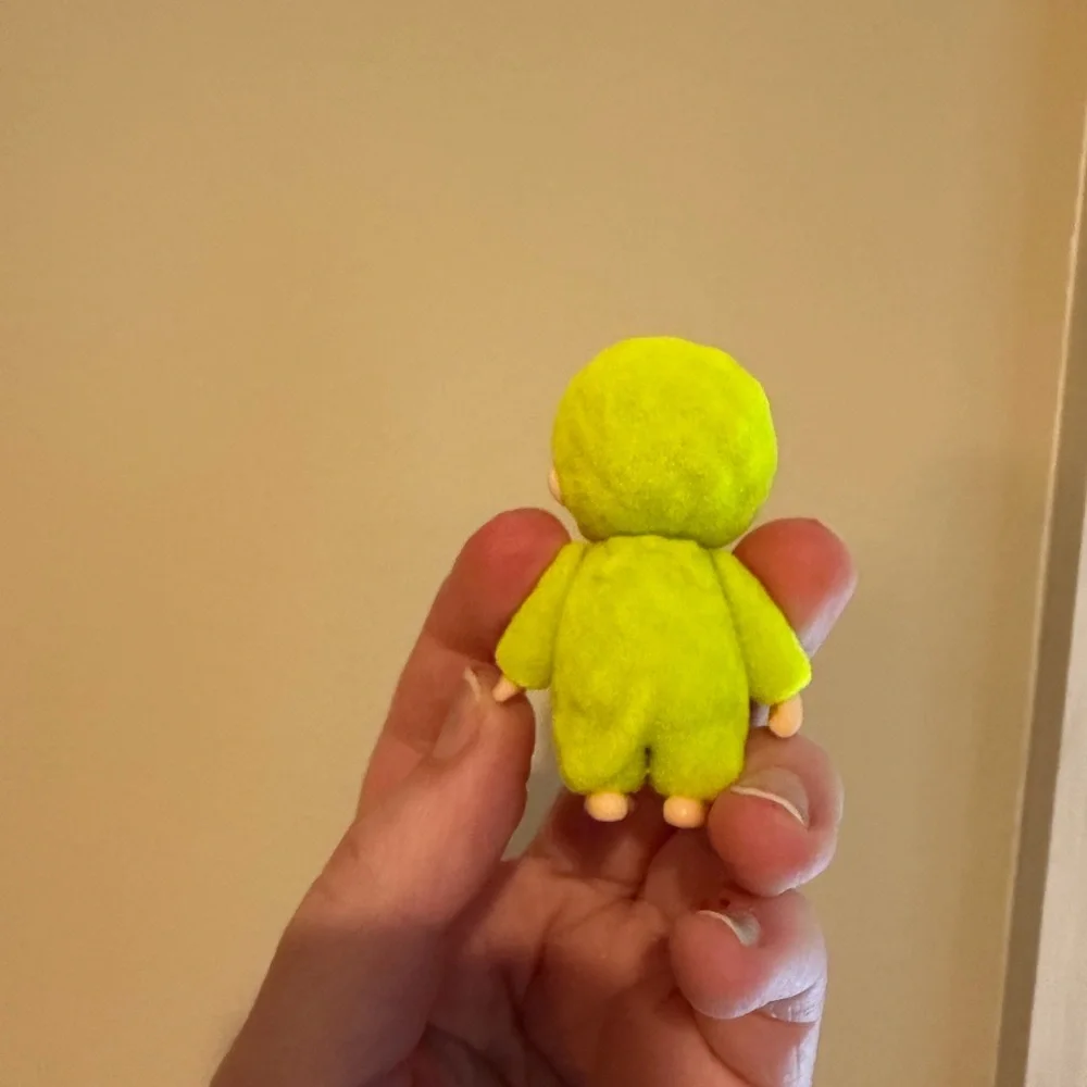 Neon yellow Monchhichi doll
